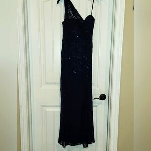 Navy blue one shoulder sparkly formal dress.
